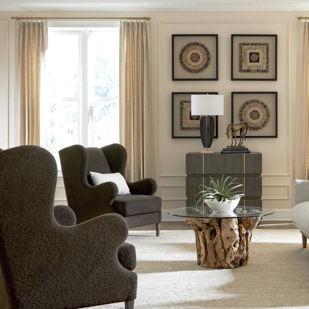 Elegant coffee chair with curved wingback design, chocolate faux shearling, and tapered wooden legs.