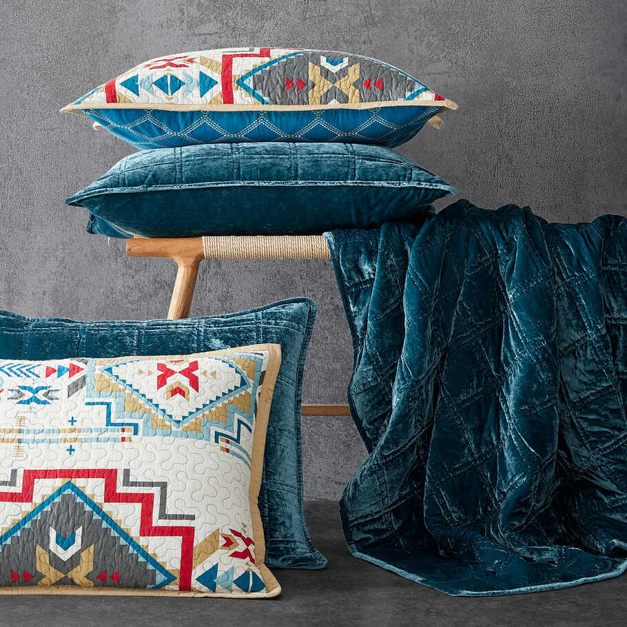 Teal Faux Silk Velvet Quilt Set displayed with coordinating pillow shams, highlighting the cohesive design and elegant stitching.