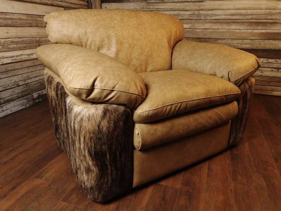 Angled view of the Texas Longhorn Recliner in a reclined position, highlighting the luxurious leather upholstery and cowhide accents.