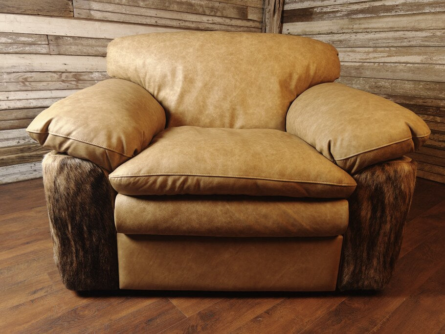 Front view of the Texas Longhorn Recliner showcasing its plush Longhorn Oatmeal leather upholstery and medium exotic brindle cowhide accents on the sides and back.
