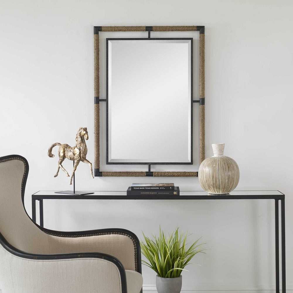 Caster Rectangular Mirror with textured rust black forged iron frame and natural rope accents.