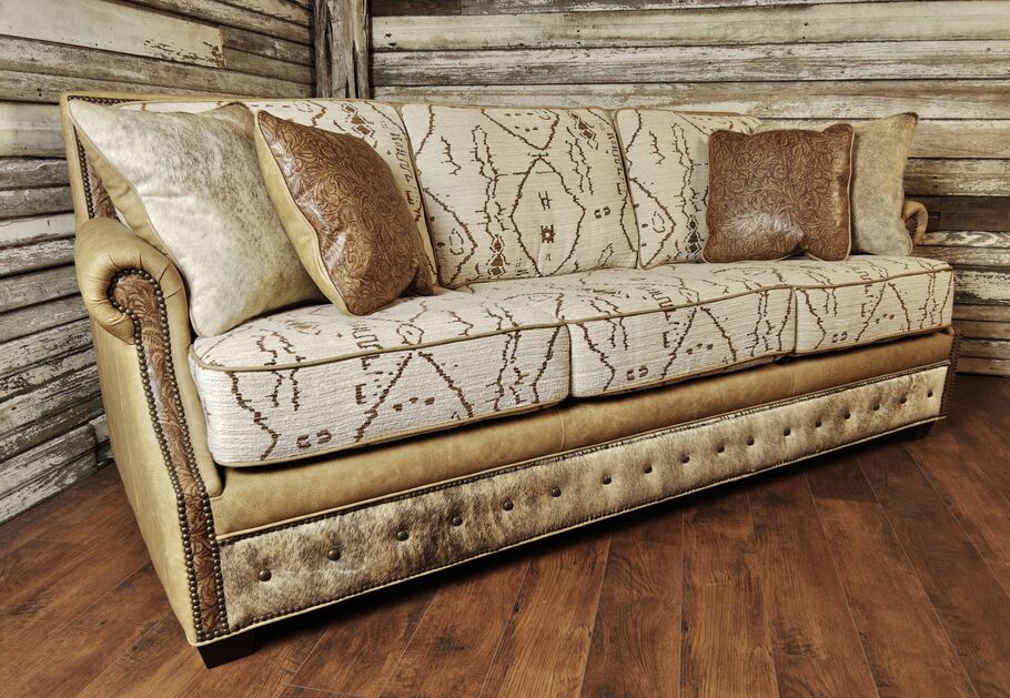 Angled perspective of The Highlands Sofa highlighting its rolled arms and sleek profile.