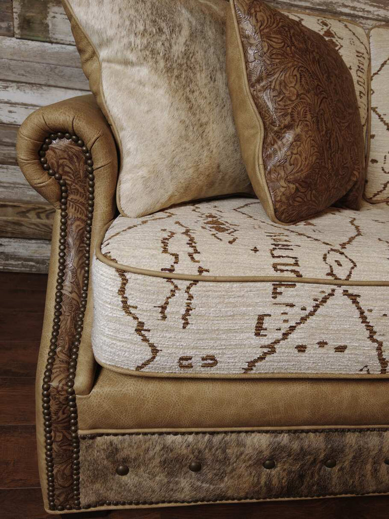 Close-up of The Highlands Sofa's seat cushion, upholstered in Andobacco fabric with an ancient pattern.