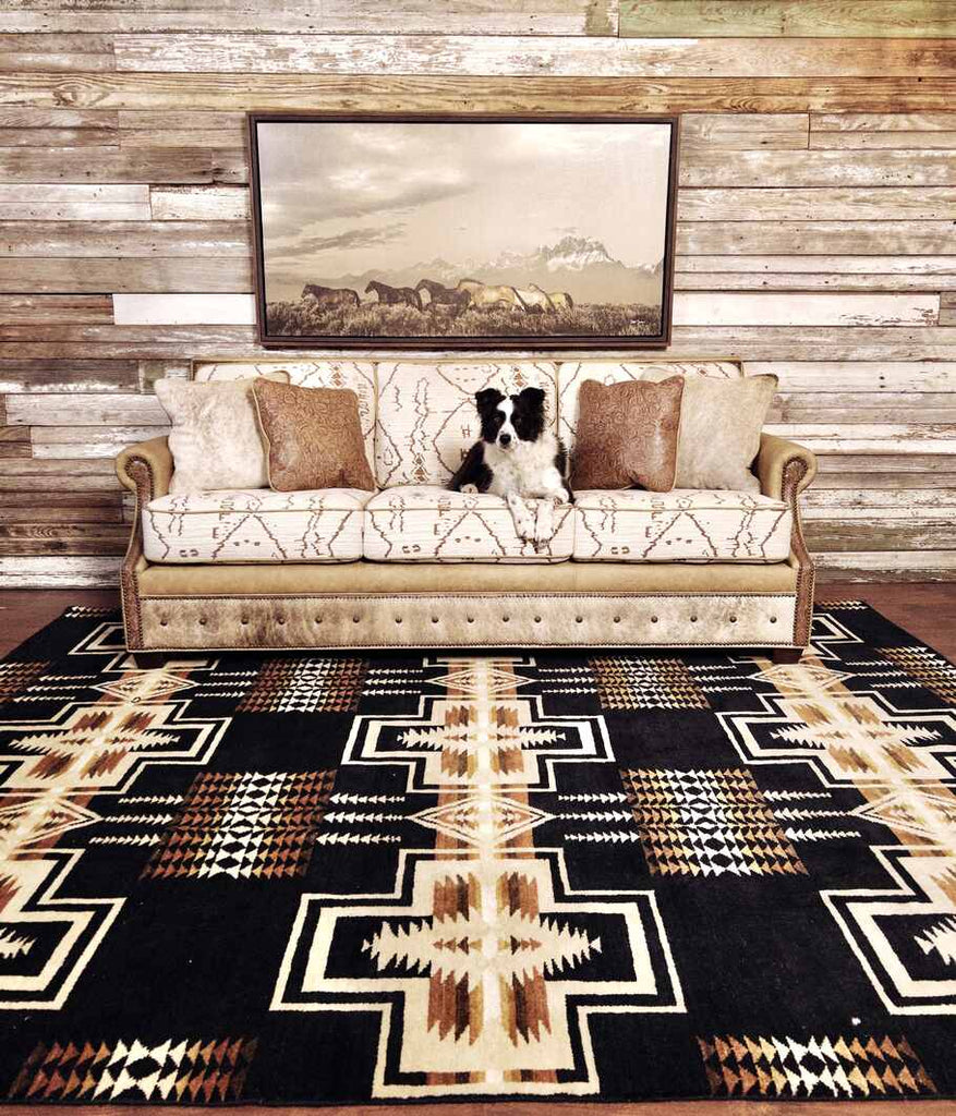 The Highlands Sofa with a dog sitting on it that is placed in a living room setting, illustrating its versatility and Western charm.