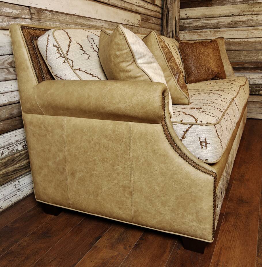 Side profile of The Highlands Sofa emphasizing its elegant design and detailed craftsmanship.