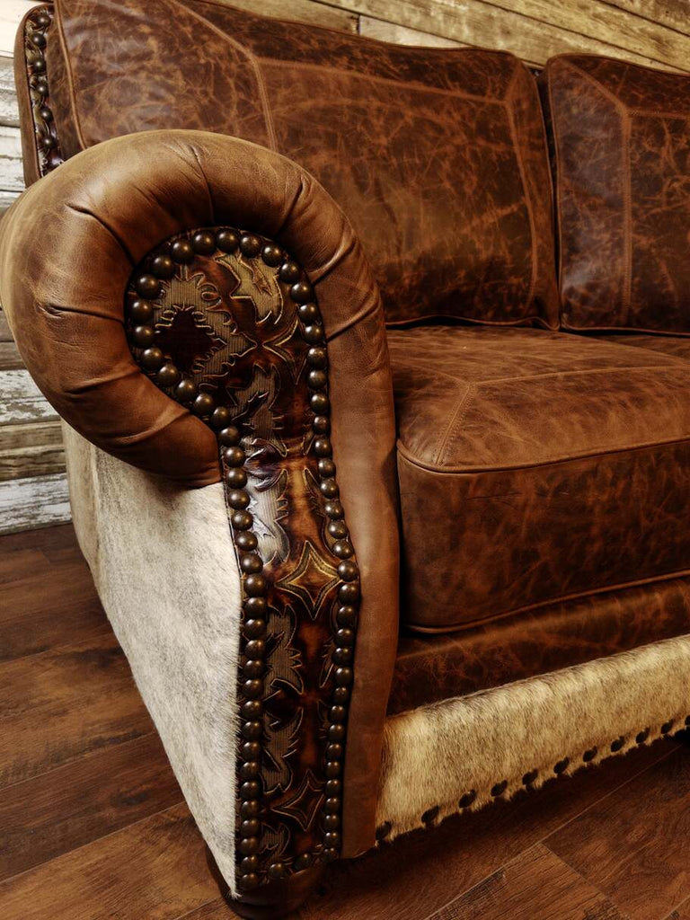 A detailed shot of the Cora Pecan leather upholstery and meticulous stitching, showcasing the fine craftsmanship and durability of The Ranchman Curved Sectional.