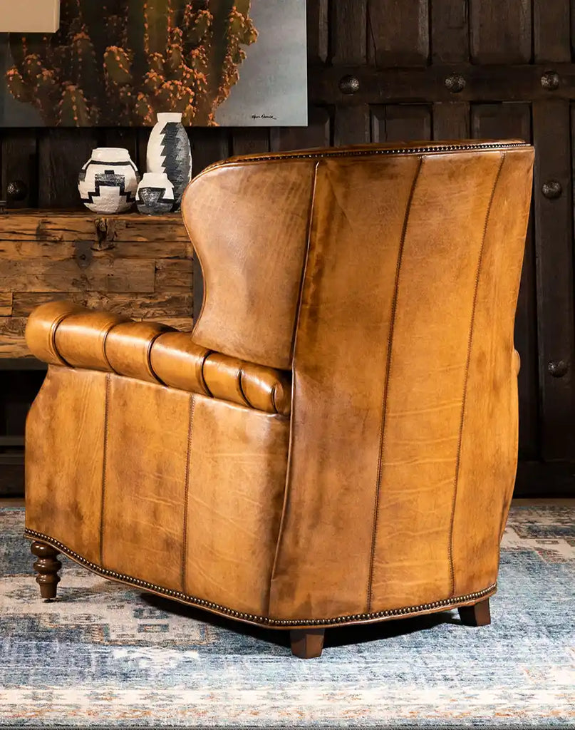 Rear image of the Thompson Saddle Recliner, showcasing the premium leather finish and sleek silhouette.