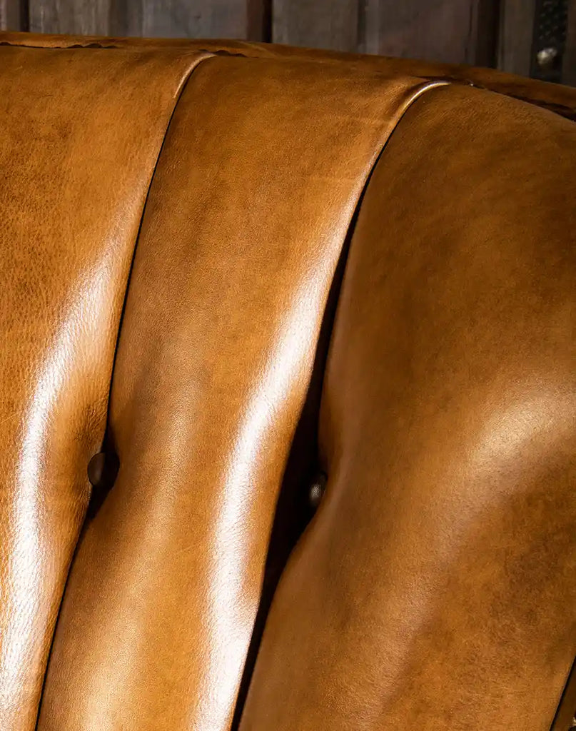Detailed shot emphasizing the rich grain and natural variations of the hand-burnished Remington Tanner leather.