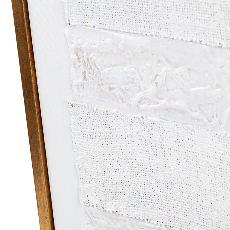 Close-up of a textured white surface with a wooden frame on the left.