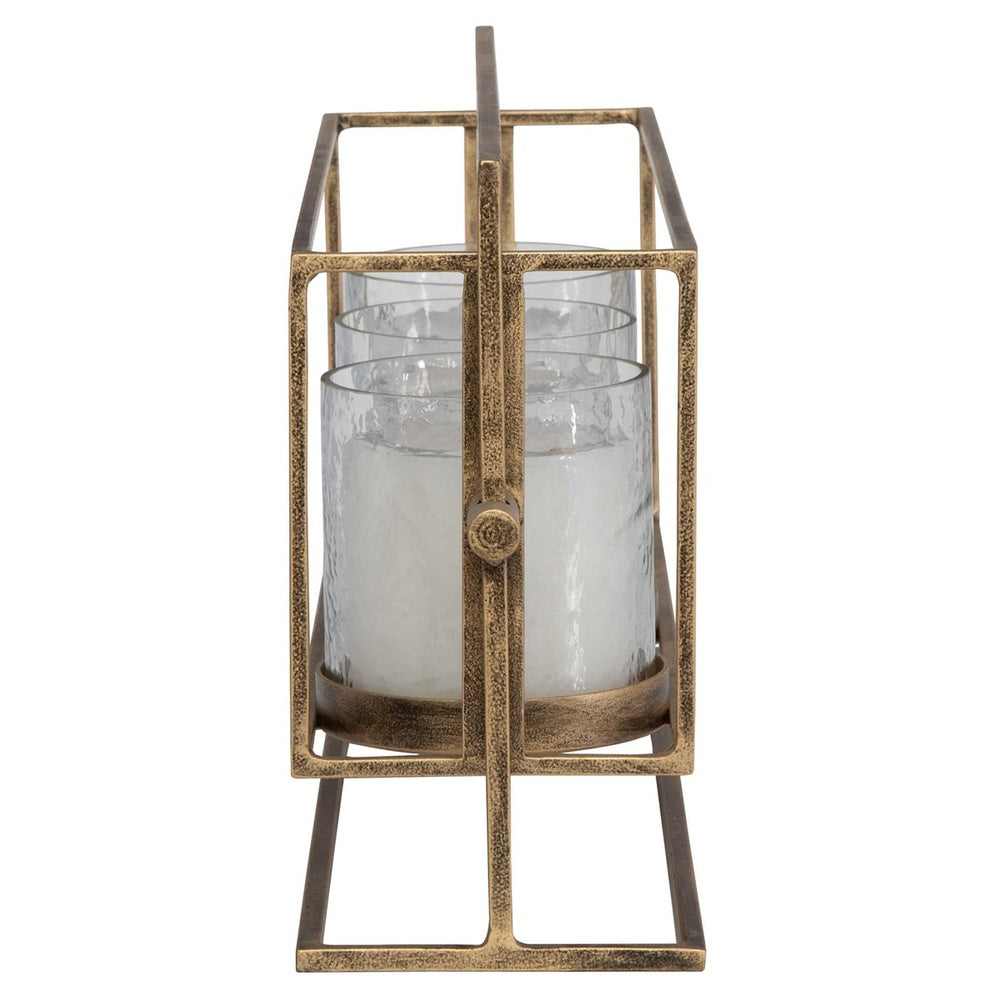 Rustic candle lantern with removable textured glass hurricanes, iron stand in antique gold, and three white 3"x 3" pillar candles included.