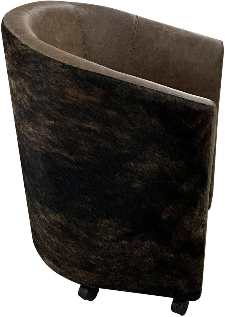 A detailed close-up of the Vegas Poker Chair's Palio Rum leather, brindled cowhide, and Gator Hornback Rustic Walnut accents, emphasizing its high-end materials and craftsmanship.