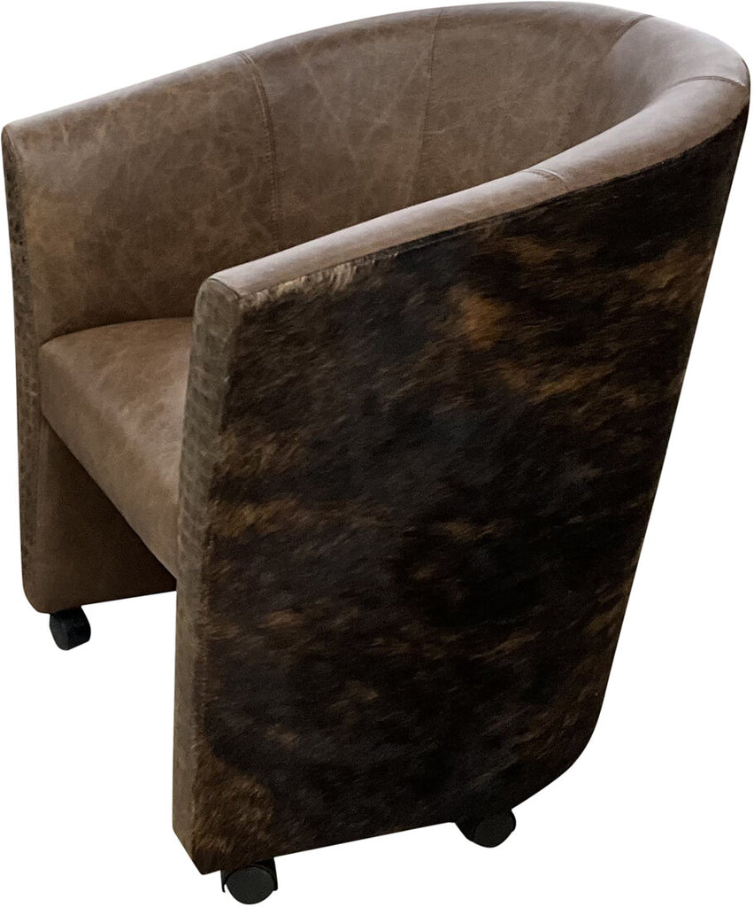 A side profile of the Vegas Poker Chair displaying the dark brindled cowhide on the arms and back, highlighting its Western-style craftsmanship.