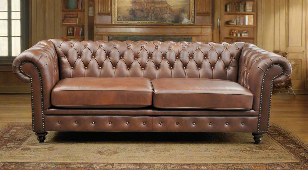 Brown leather sofa with two seat cushions, tufted backrest on a white background