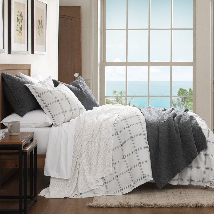 Windowpane Plaid White Lodge Comforter Set styled in a cabin bedroom setting, complemented by wooden accents and cozy decor elements.