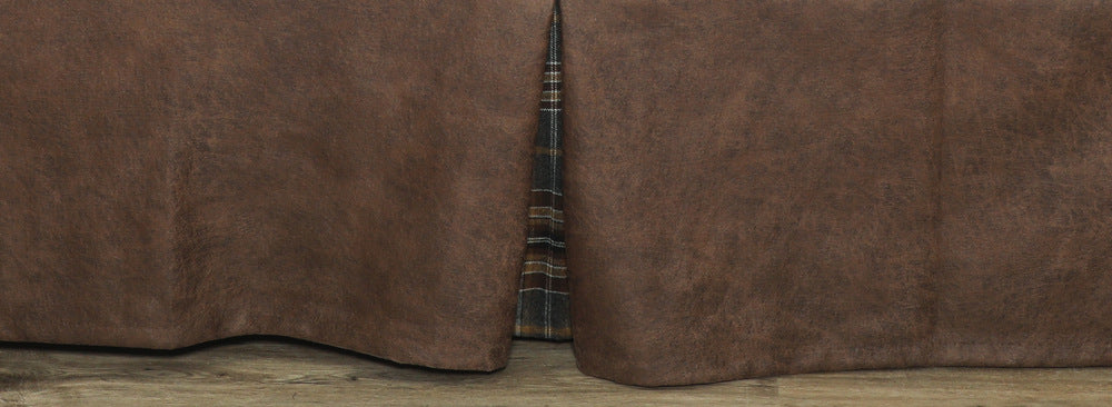 Wooded River Kinsale Oxford Lodge bedskirt in faux leather Bourbon with pleated design and Kinsale Oxford plaid gussets, styled on a rustic lodge bed.