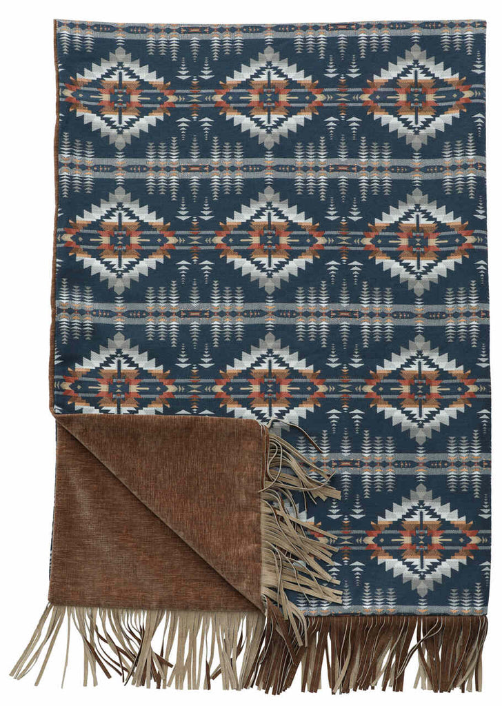 Wooded River Moreno Midnight 55x72 Throw with Juniper Mesa Indigo Sunbrella front, Contessa Ginger polyester back, and Run Wyld Gentle Fawn cowhide fringe; features rich tones of navy, indigo, brown, white, and taupe.