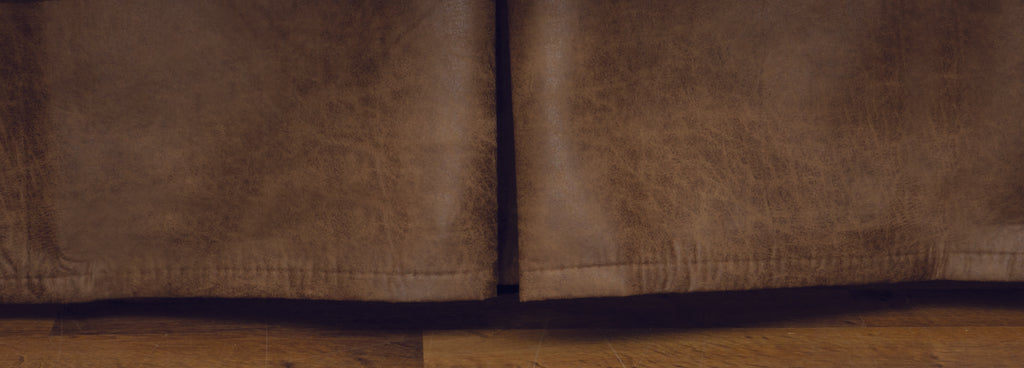 Wooded River Puesta Del Sol faux leather bedskirt with 15-inch drop, featuring rustic brown tones and durable cotton/polyester decking for a polished, Southwestern-inspired bedroom look.