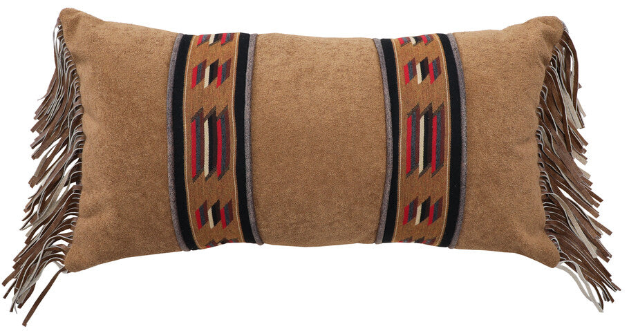 Wooded River Sun Valley Mojave Decor Pillow measuring 14" x 26", featuring a blend of Sun Valley Mojave fabric (100% Sunbrella Acrylic) and Nougat side panels (100% Polyester), accented with Run Wyld Gentle Fawn fringe (100% Cowhide). Designed in rich earthy tones with a geometric pattern, this decorative pillow includes a plush polyester fill and complements all Sun Valley Mojave bedding items.