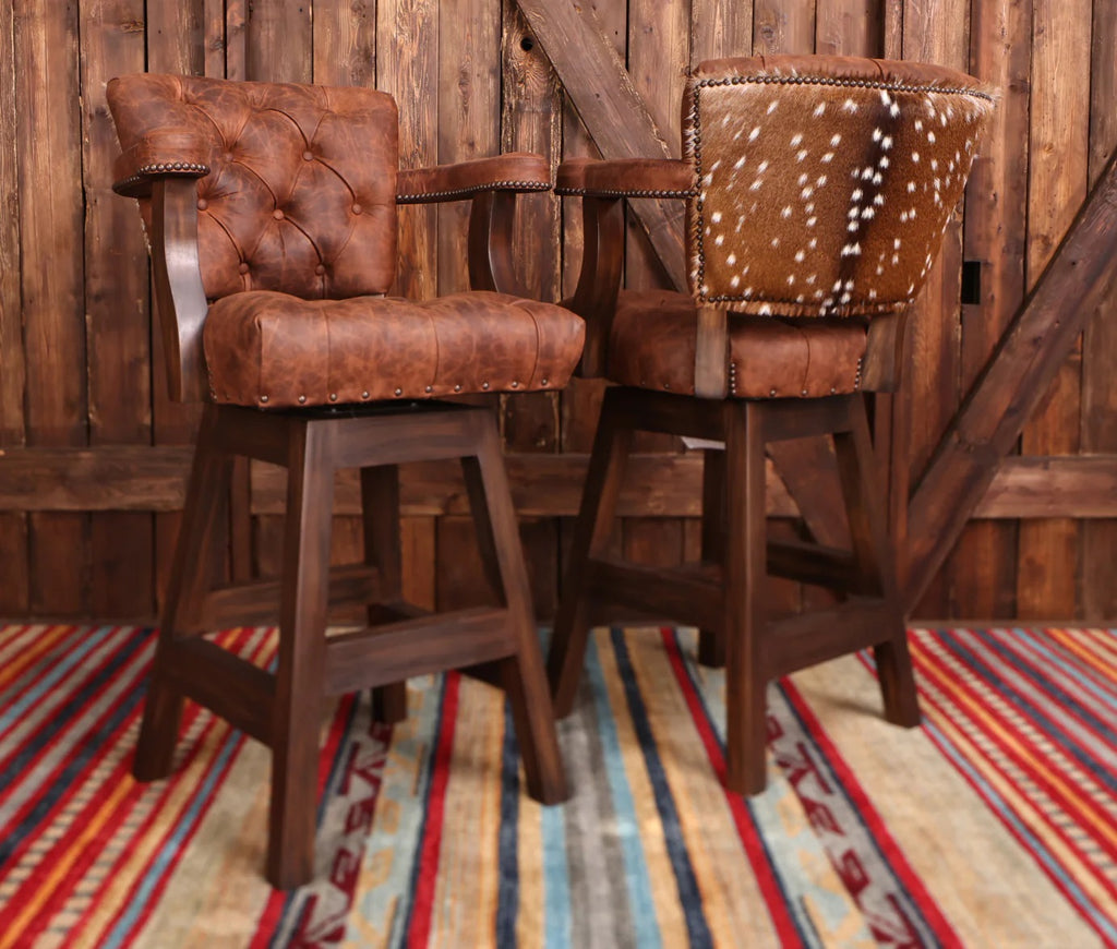a pair of Axis Hide Tufted Pecan Swivel Barstools