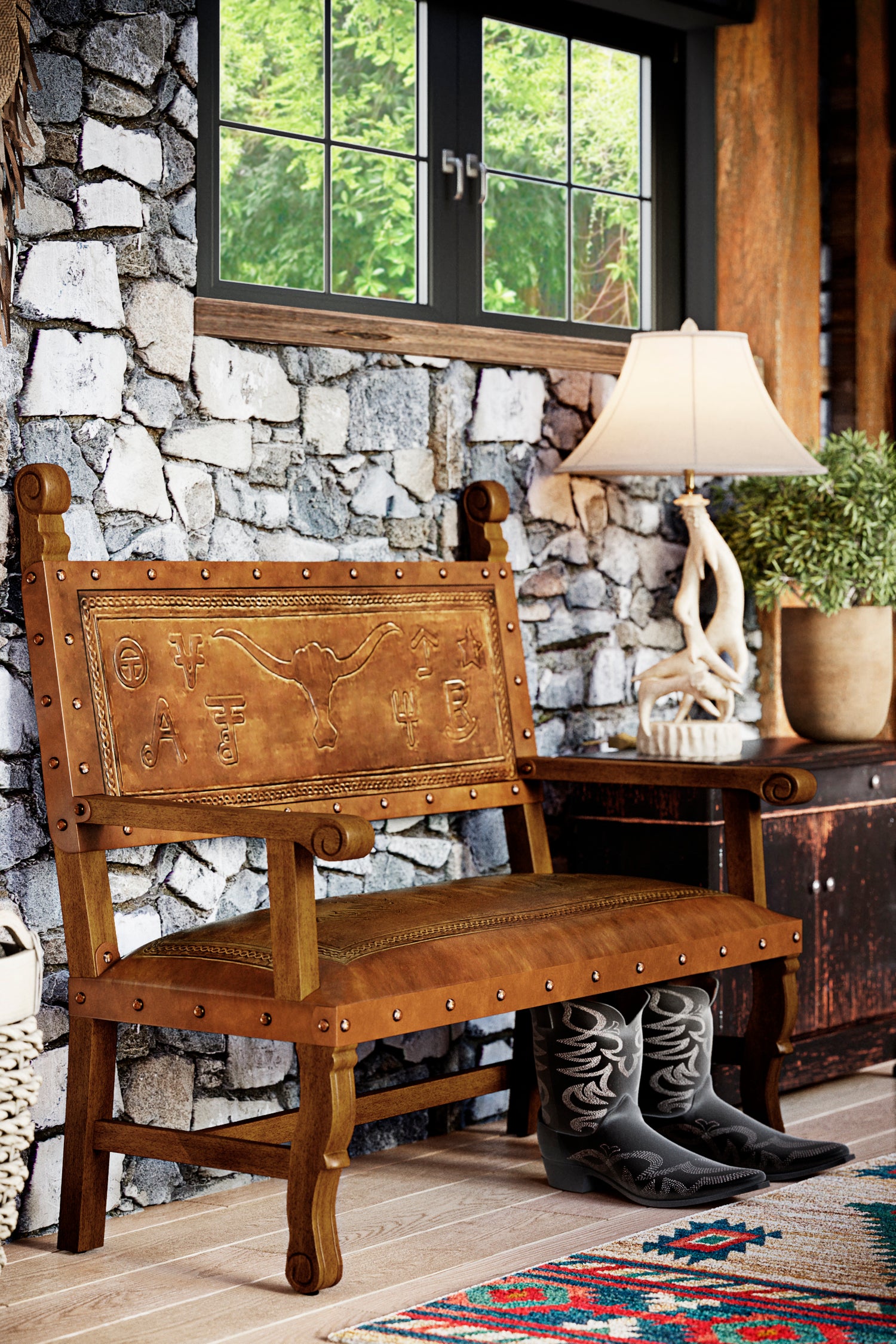 A rustic brown leather bench with a hand-carved longhorn and cowboy posse design, placed in a home setting with stone wall and wooden furniture in the background.