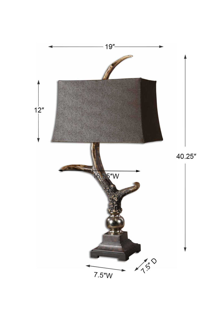 A close-up of the Wild Stag Horn Table Lamp’s base featuring a burnished bone ivory finish, cast aluminum accents, and crackled wood tones.
