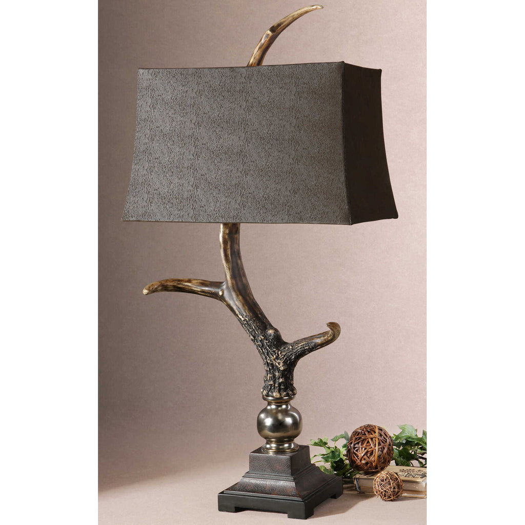 The Wild Stag Horn Table Lamp highlighting its elegant rectangle semi-drum shade made of sueded chocolate fabric, creating a warm and sophisticated look.